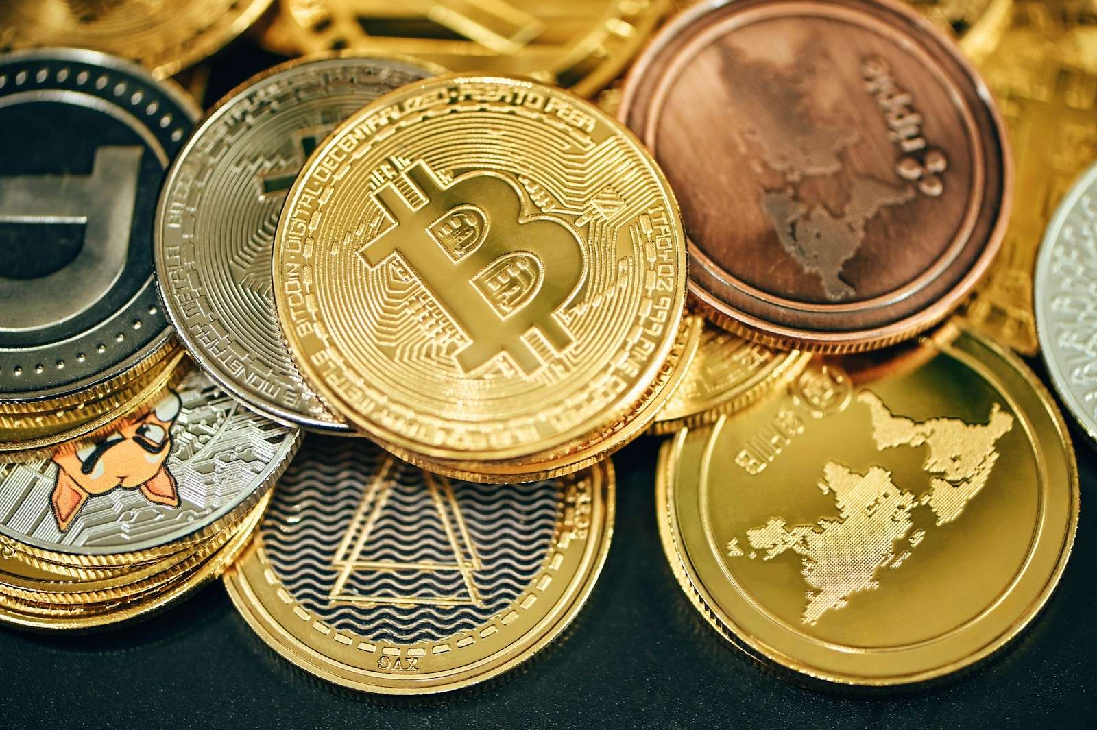 a pile of gold and silver bitcoins Alternative Investments