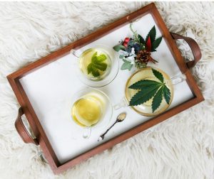 rectangular brown wooden tray filled with tea